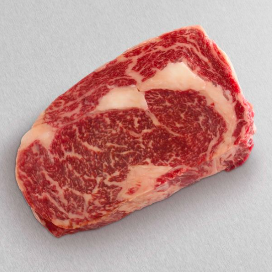 american wagyu gold grade ribeye steak with rich marbling