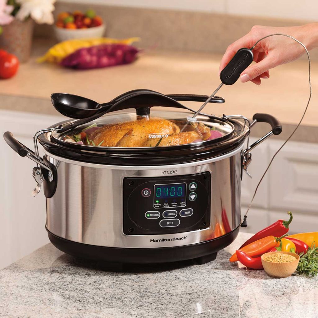 Hamilton Beach Set & Forget Programmable Slow Cooker With Temperature Probe 33967 review product a hand holding temperature probe