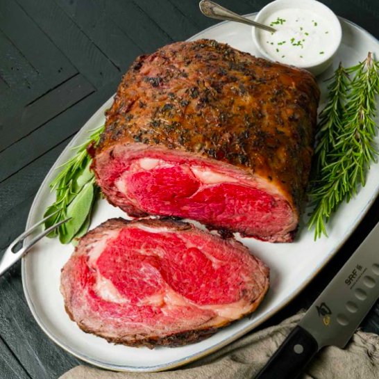 american wagyu gold grade boneless prime rib roast cooked medium rare carved