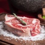 most expensive steak cuts rich marbling on wooden plate with salt