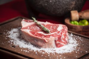 most expensive steak cuts rich marbling on wooden plate with salt