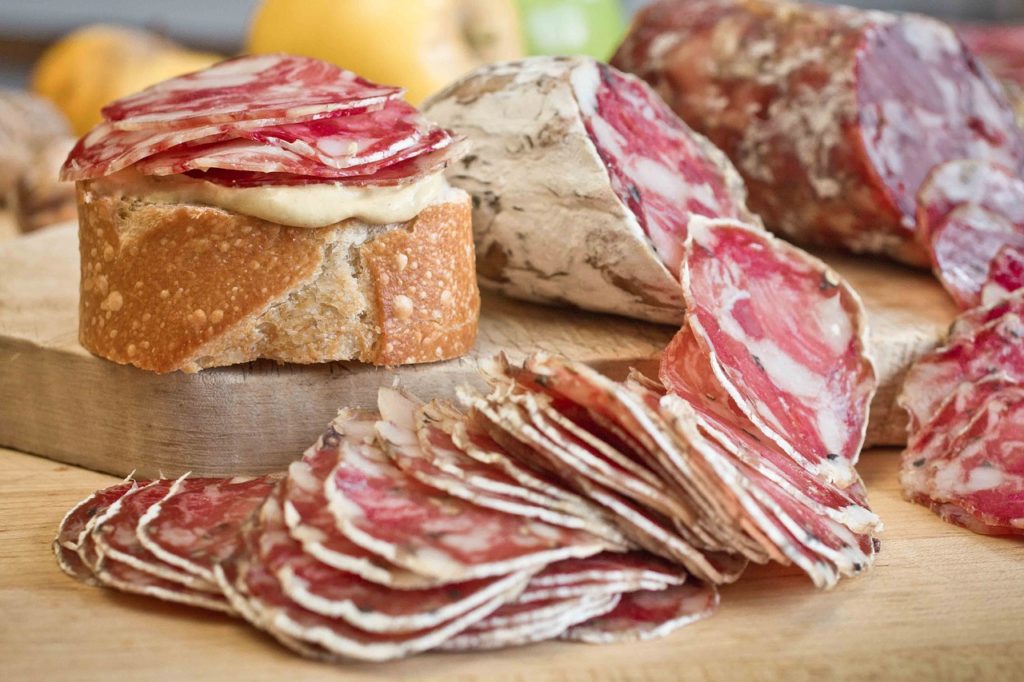 salami slices with bread and pate