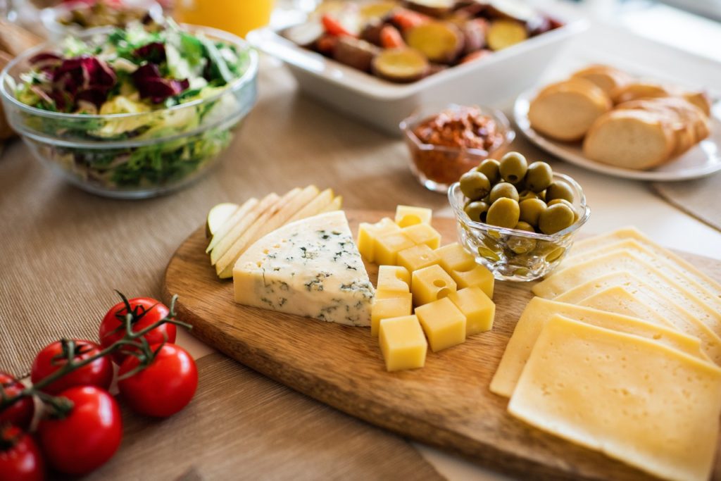 cheese pairing with bread olives fruit salad