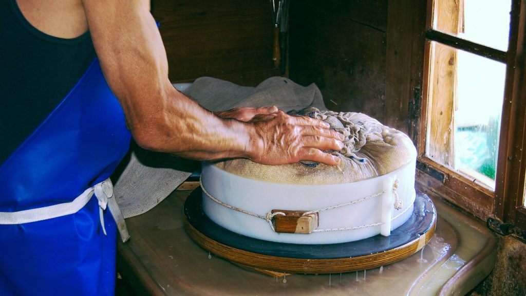 making cheese separating straining curds and whey