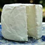 white goat cheese on blue plate