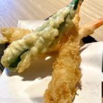 Recipe for Tempura Shrimp and okra on cooking paper on wooden table