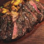 Grilled Sliced Tomahawk Steak with fried potatoes